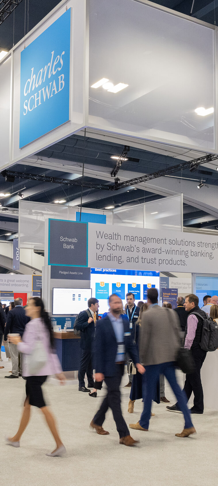 People mingling in Schwab Center at IMPACT 2024.