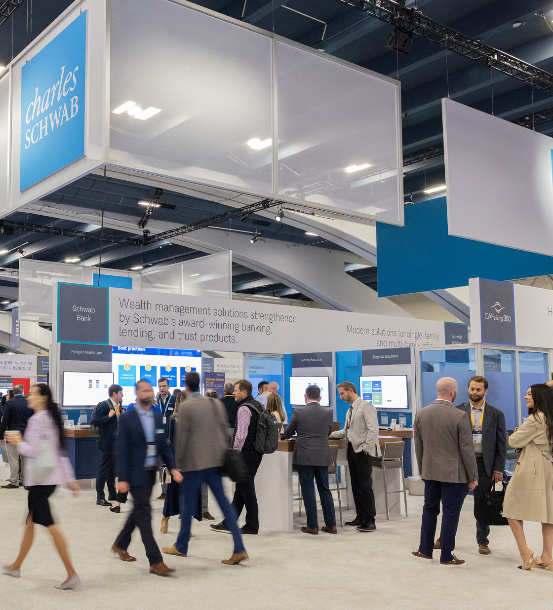 People mingling in Schwab Center at IMPACT 2024.