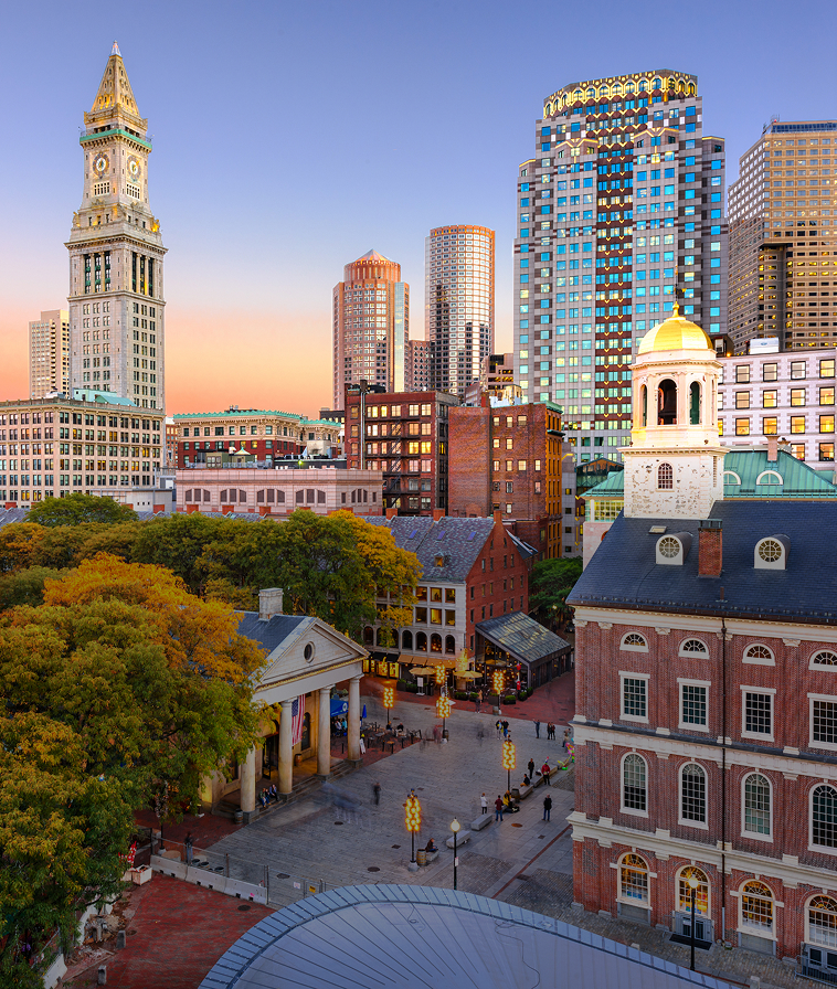 Downtown Boston skyline in autumn at dusk.