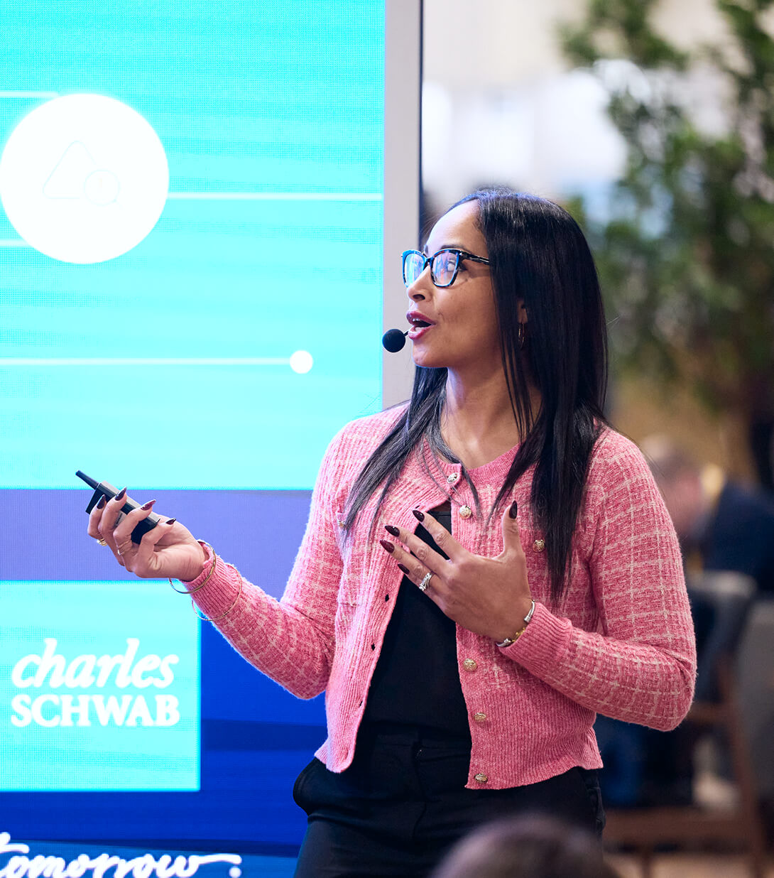 Woman delivering a slide presentation at an education session in The Exchange at IMPACT 2025. Indicate your interest to speak at IMPACT 2026.