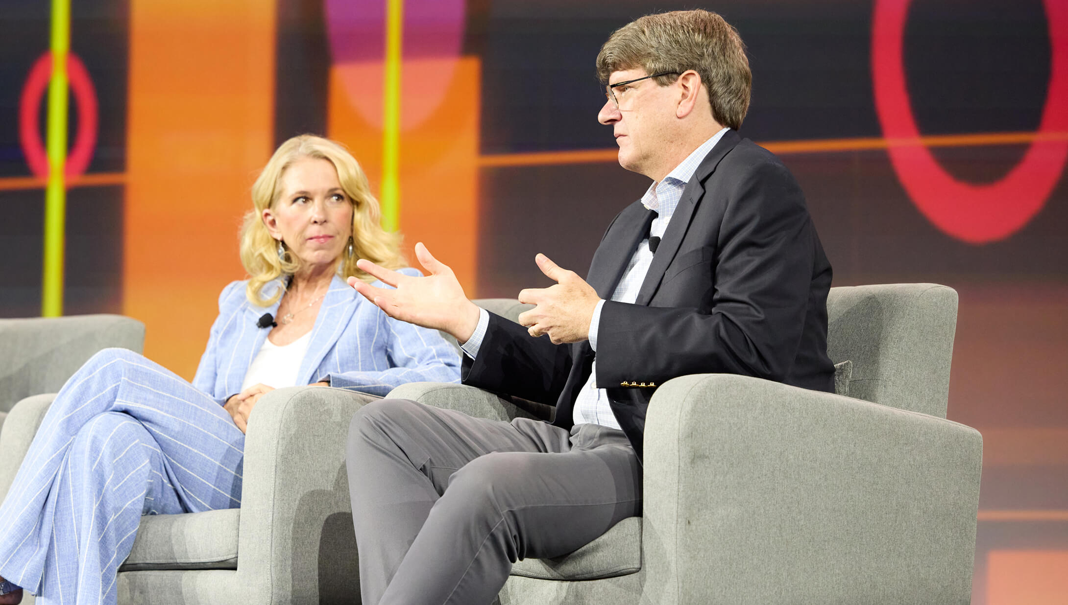 Schwab employees Liz Ann Sonders and Michael Townsend seated onstage during their keynote session at IMPACT 2025.
