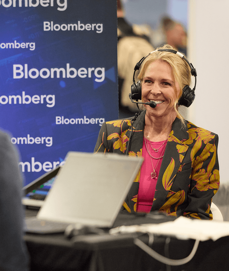 Liz Ann Sonders being interviewed in front of a Bloomberg backdrop in Media Village at IMPACT 2025.